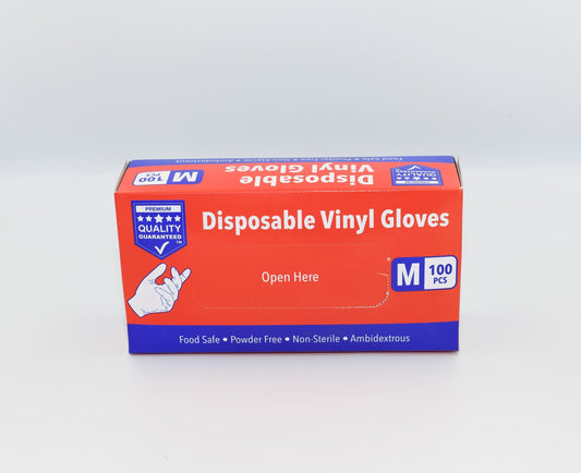 A box of medium-sized disposable vinyl gloves from a premium quality brand, with a label indicating features such as food safe, powder free, non-sterile, ambidextrous design, and suitability for medium-sized hands. – Quickway Supplies