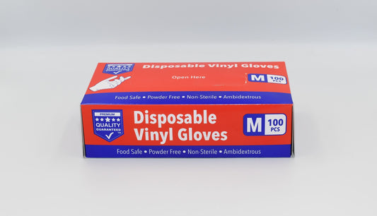 A box of medium-sized disposable vinyl gloves from a premium quality brand, with a label indicating features such as food safe, powder free, non-sterile, ambidextrous design, and suitability for medium-sized hands. – Quickway Supplies